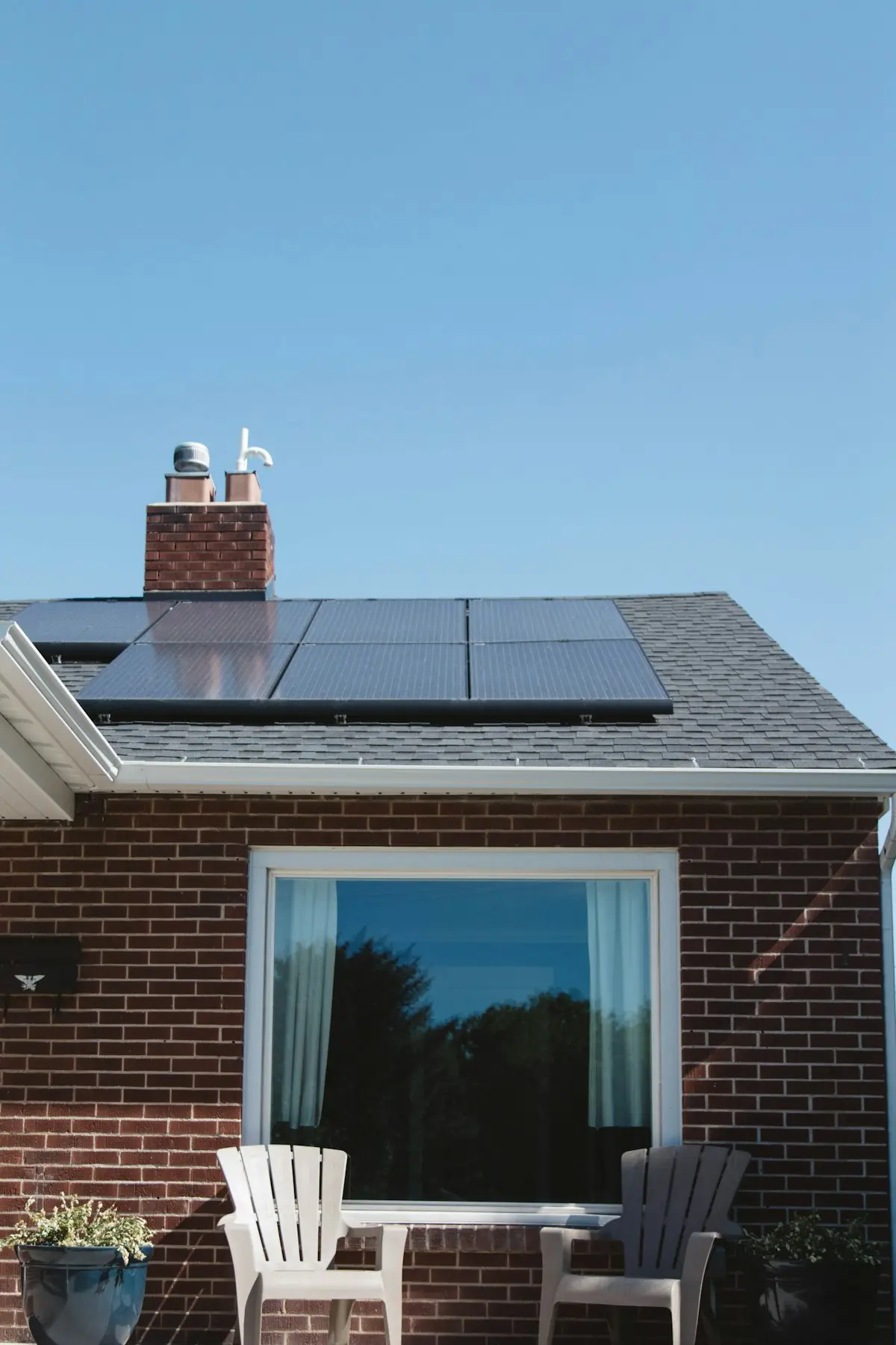 Two-story house with solar panels on the roof